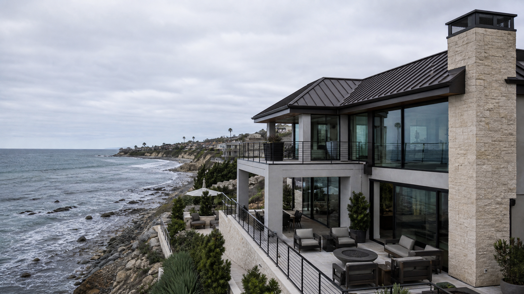 Oceanfront home with a coastal standing seam metal roof