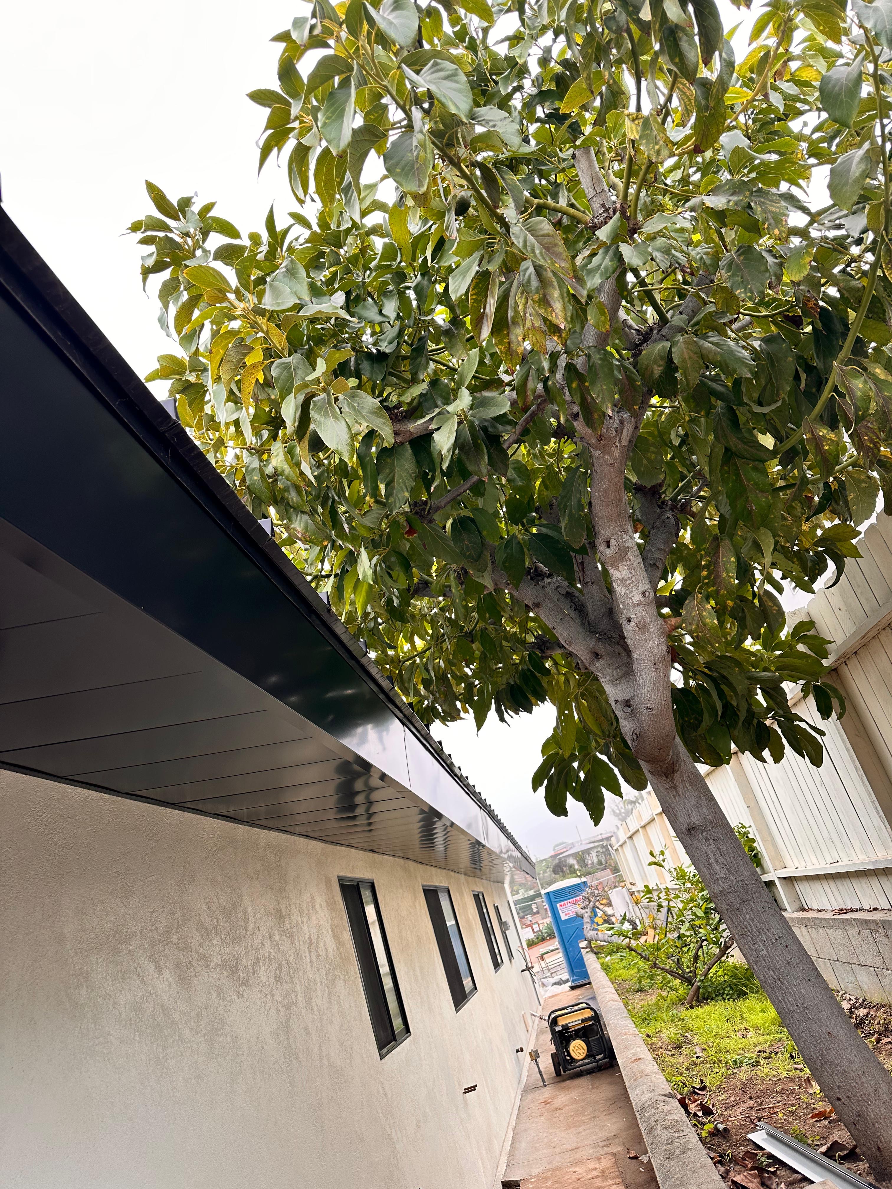 Metal soffit panels enclosing the eaves, color-matched to the roof.