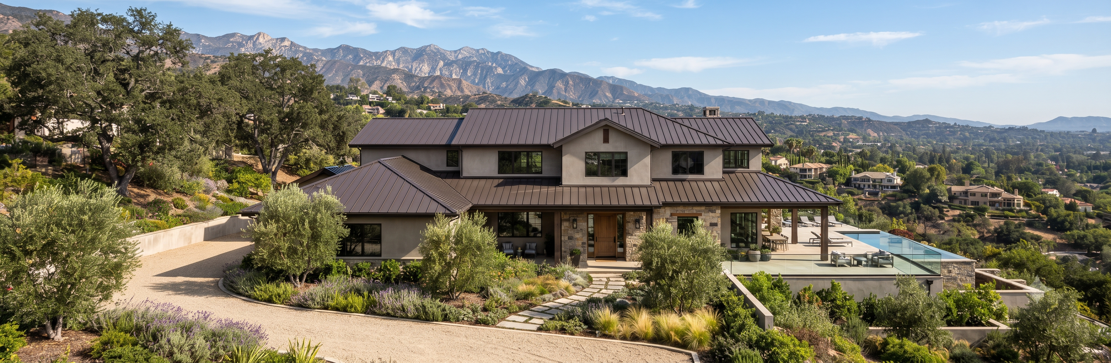 Dark bronze standing seam metal roof on a two-story modern farmhouse estate with mountain views in La Canada Flintridge