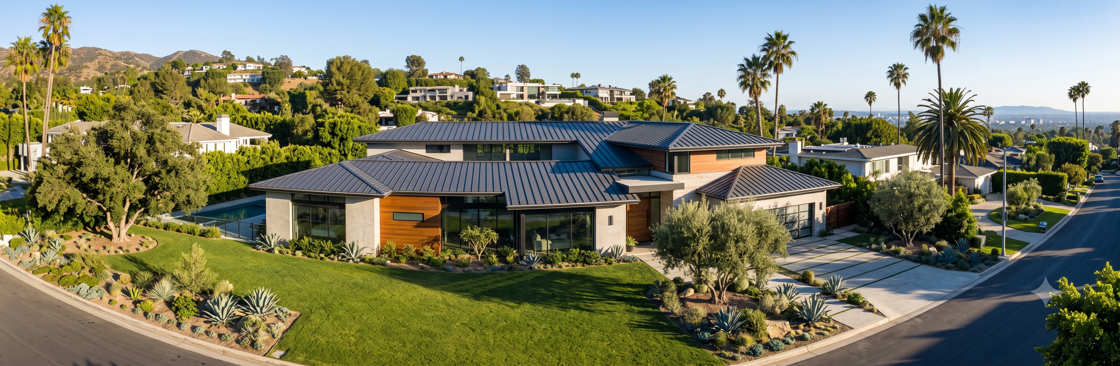 Charcoal standing seam metal roof on a modern hillside estate in Brentwood
