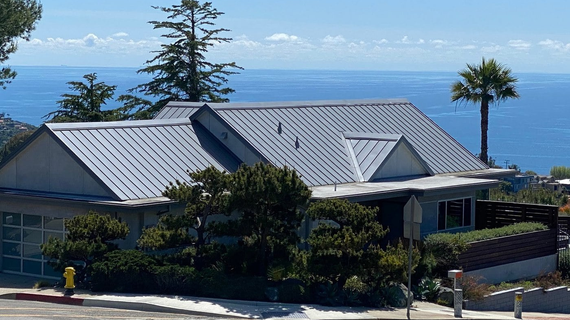 Coastal home with aluminum standing seam roof near the Pacific Ocean
