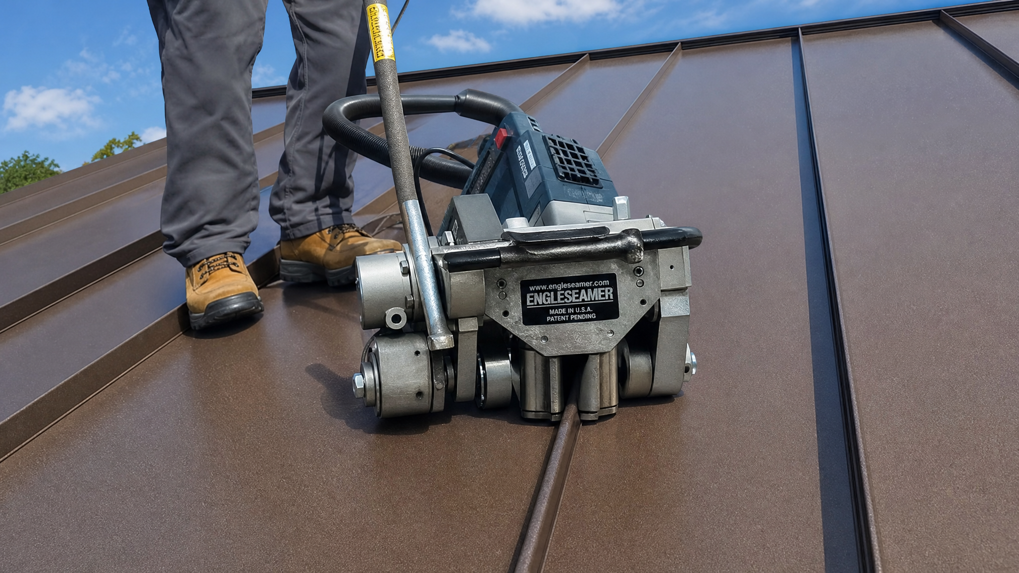 Mechanical seaming machine folding a standing seam metal roof into a double-lock seam for maximum weathertightness.