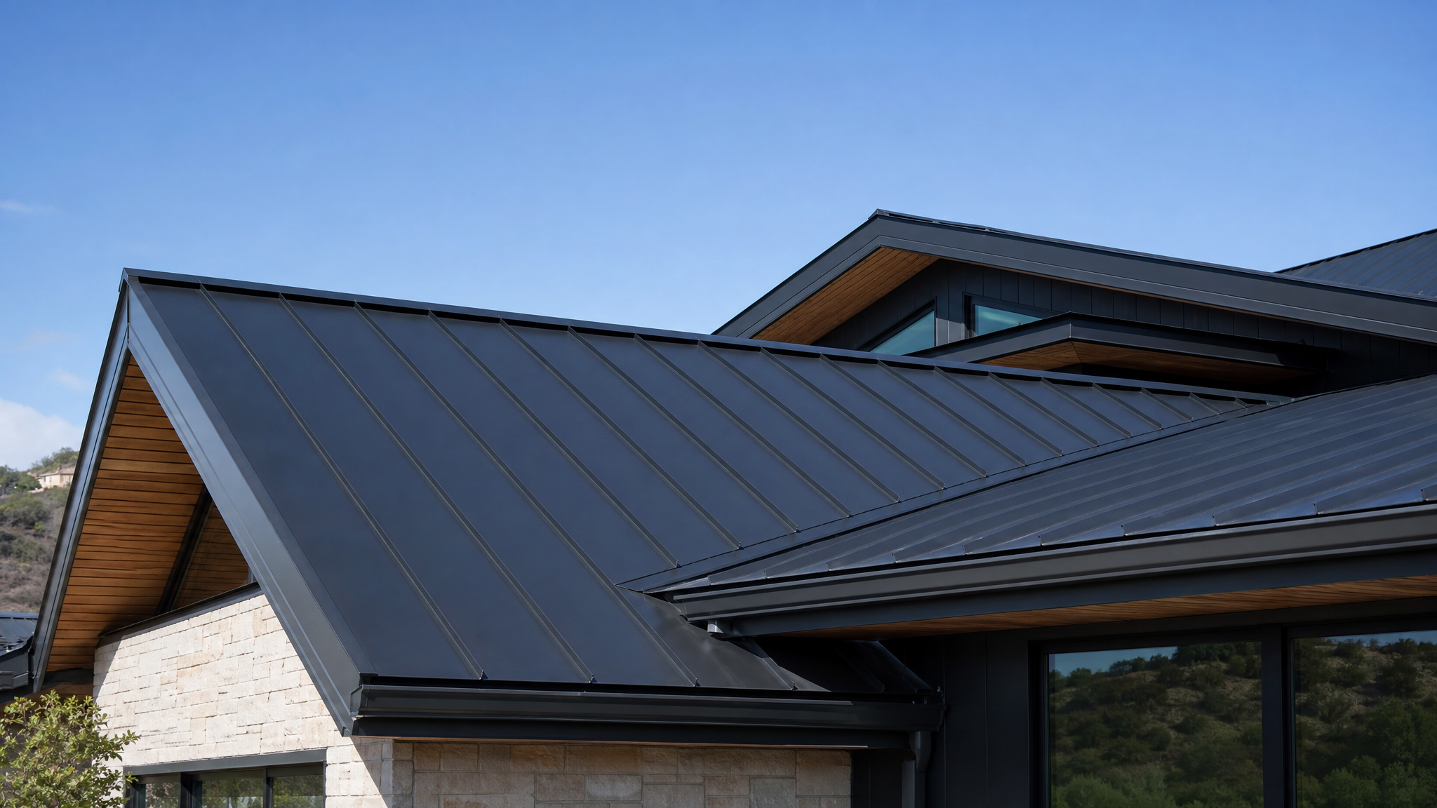 Premium standing seam metal roof installation on luxury home