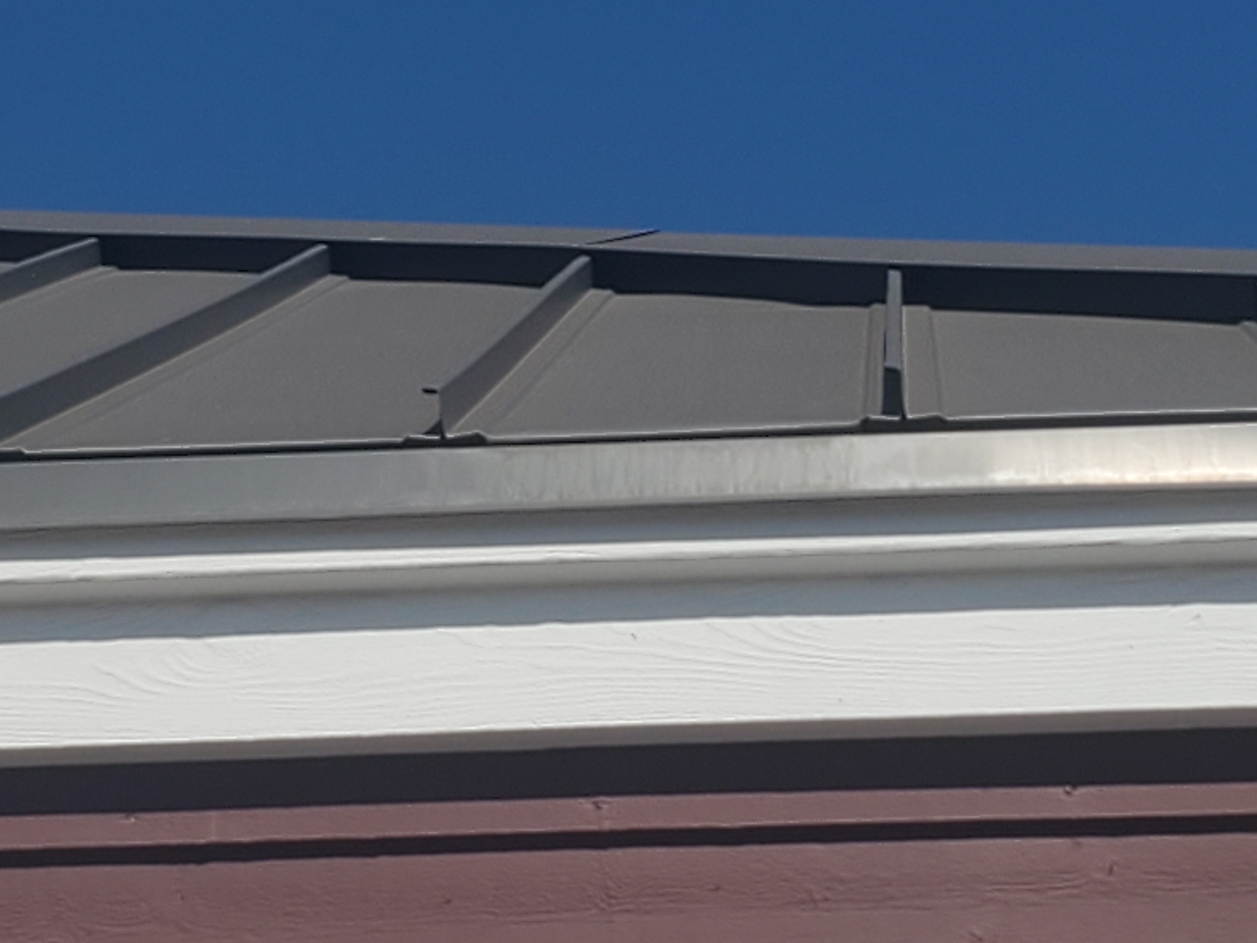 Standing seam metal roof profile detail on a commercial restaurant building