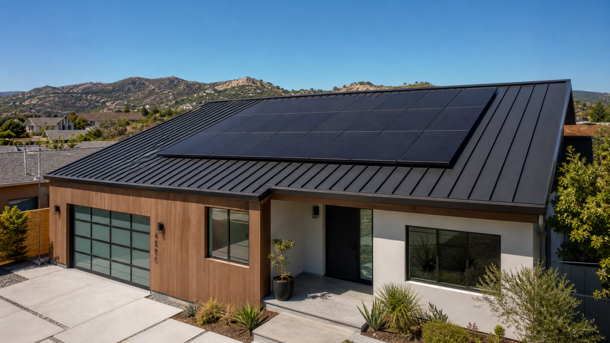 Modern standing seam metal roof integrated with solar panels on Southern California residence